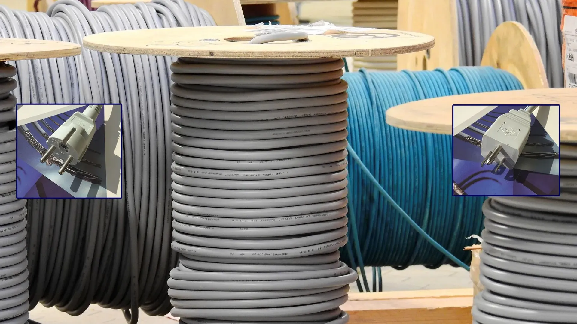 Spools of gray and blue cables neatly coiled in a workshop.